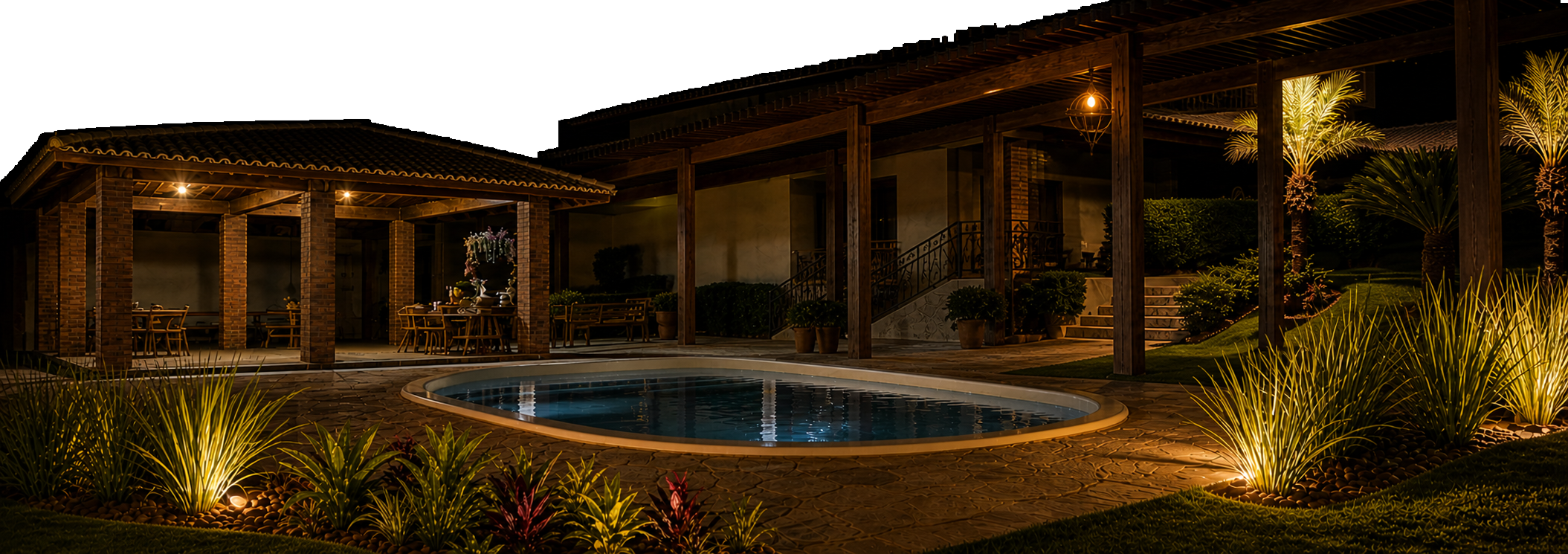 Área externa iluminada da VillaRoça à noite